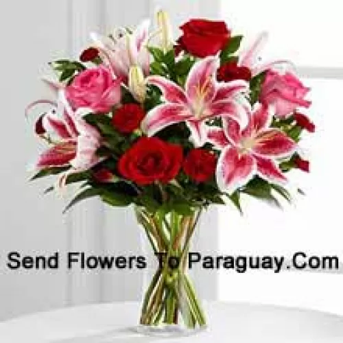 Red And Pink Roses With Pink Lilies And Seasonal Fillers In A Glass Vase